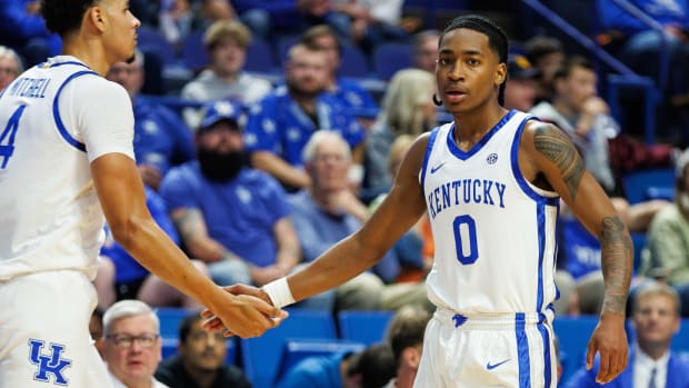 Oct 27, 2023; Lexington, KY, USA; Kentucky Wildcats guard Rob Dillingham (0) fives forward Tre Mitchell (4) during the first half against the Georgetown Tigers at Rupp Arena. Mandatory Credit: Jordan Prather-USA TODAY Sports